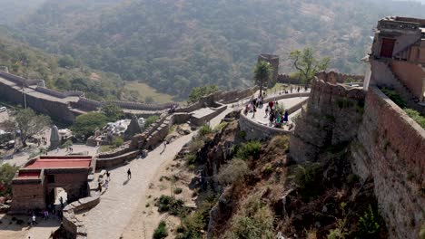 panoramic view of kumbhalgarh fort wall and landscape with tourists