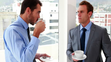 businessmen chatting and drinking coffee
