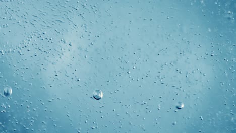 oxygen bubbles in water on a blue abstract background