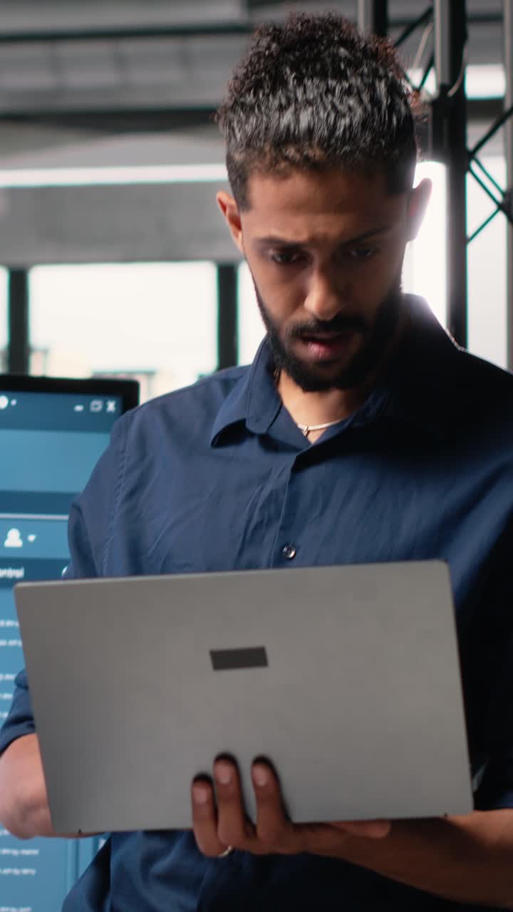 Vertical Video Middle eastern architect reviews blueprints for construction master plan