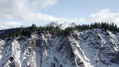 slow reveal of snow covered coastal mountains, whistler