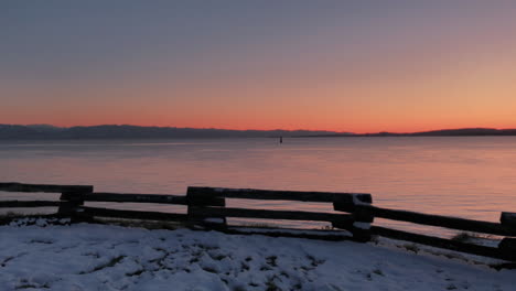 winter ocean shore in warm twilight