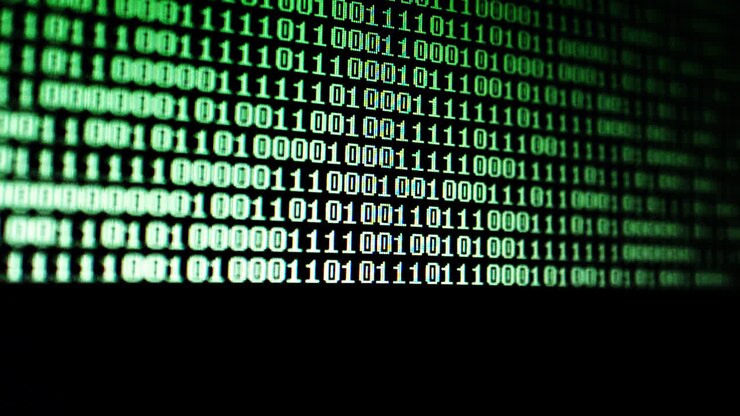 Binary code on the monitor screen. Shooting of a binary code, background