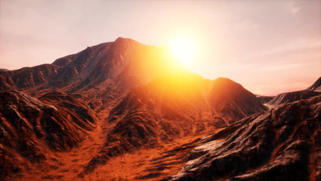 sun rays over mountains in a valley