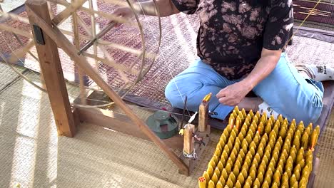 crafting silk with traditional tools in thailand