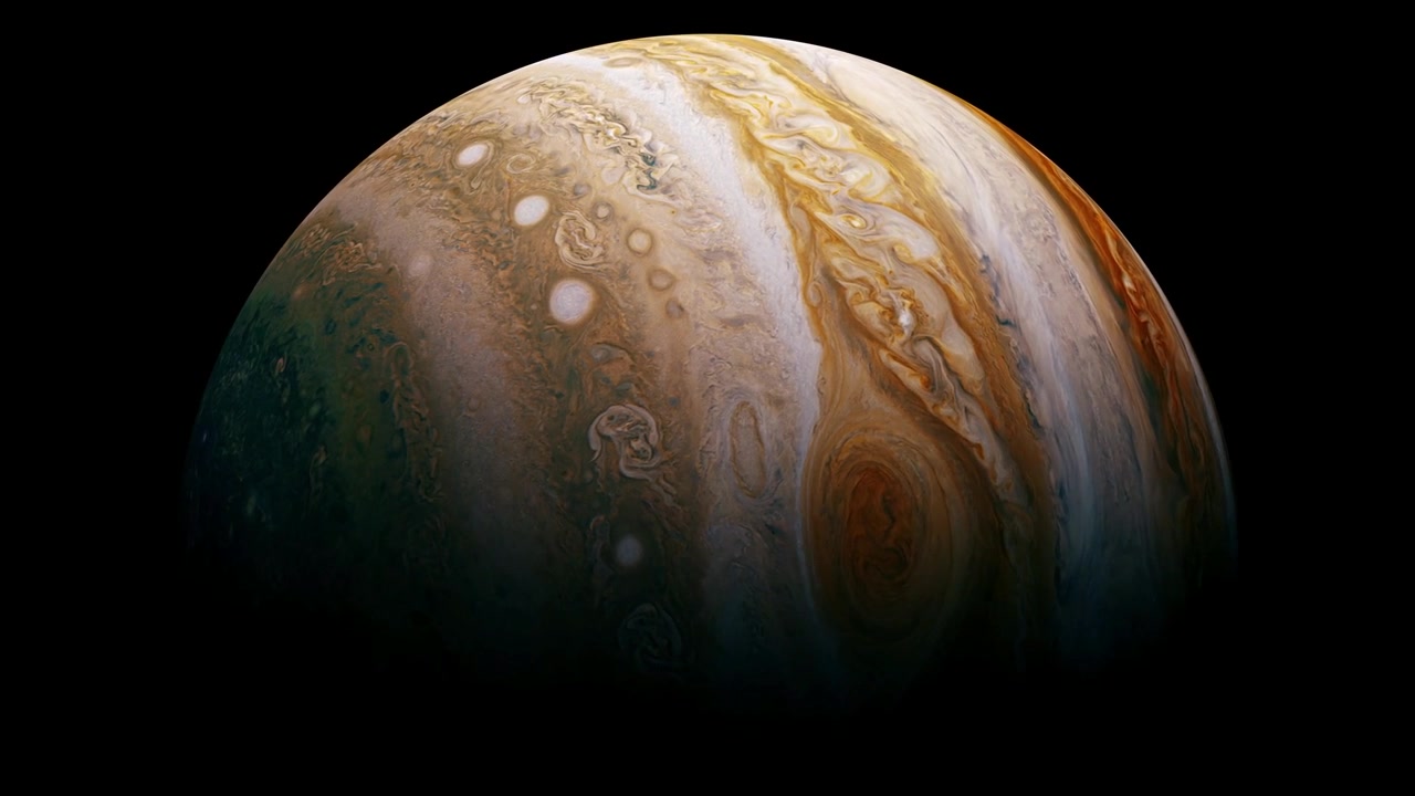 Planet Jupiter turning isolated on black.