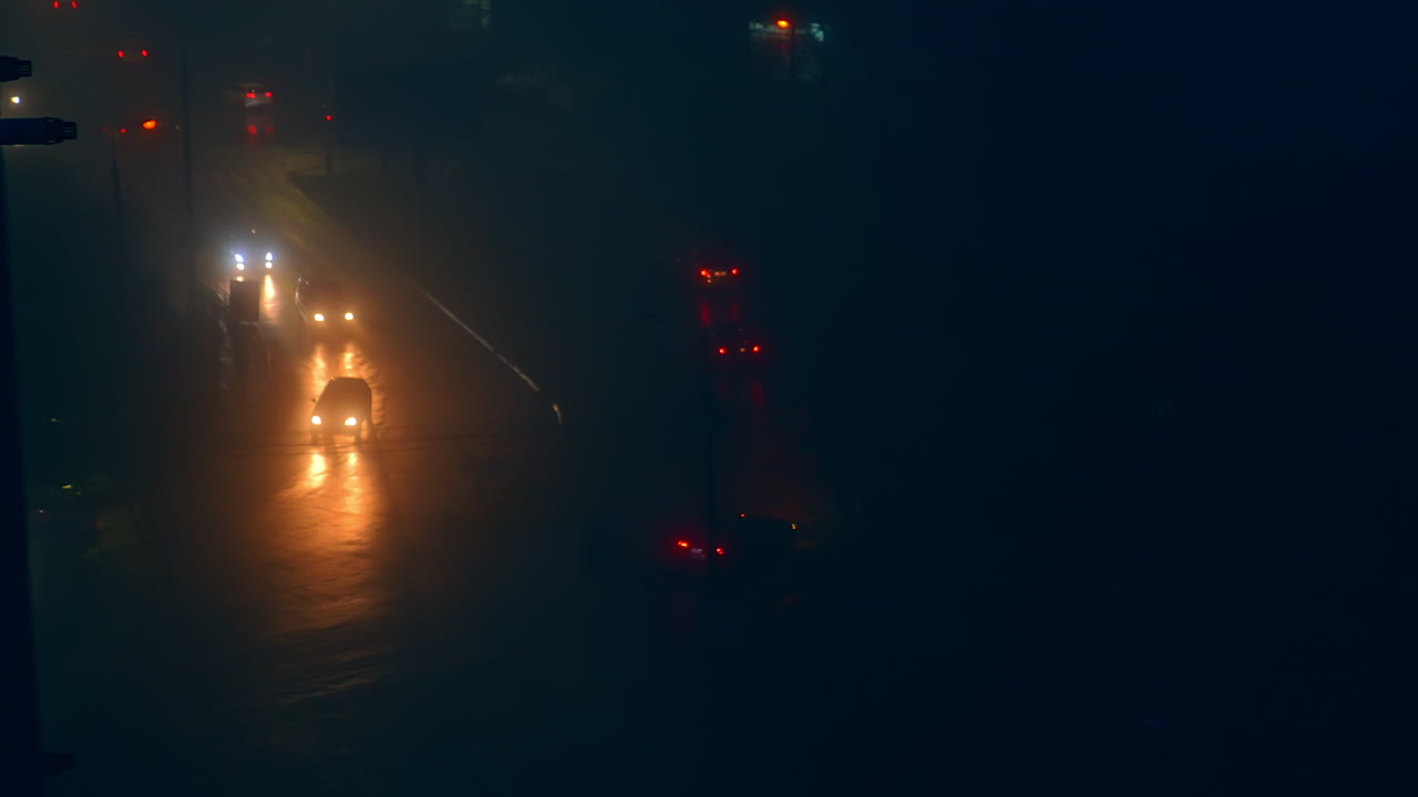 Rainy Night City Traffic in Fog