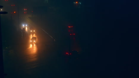 rainy night city traffic in fog
