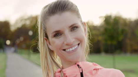 handheld video shows of smiling woman after hard workout