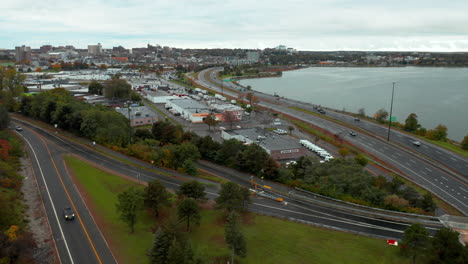 Aerial-wide-heading-into-the-city-of-Portland,-Maine