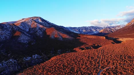 autumn snowfall along southwest mountain highways in aerial view