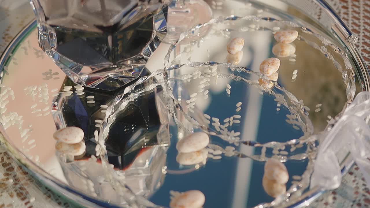 Elegant wedding crowns on mirrored glass, reflecting light and beauty