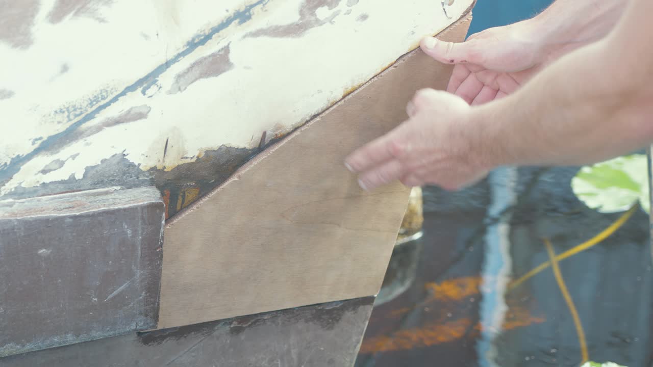Dry fitting plywood repair at the stern of a planked boat