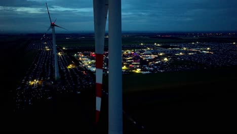 open concert in the field at night, nova rock festival in pannonia fields ii, nickelsdorf, austria - aerial drone shot