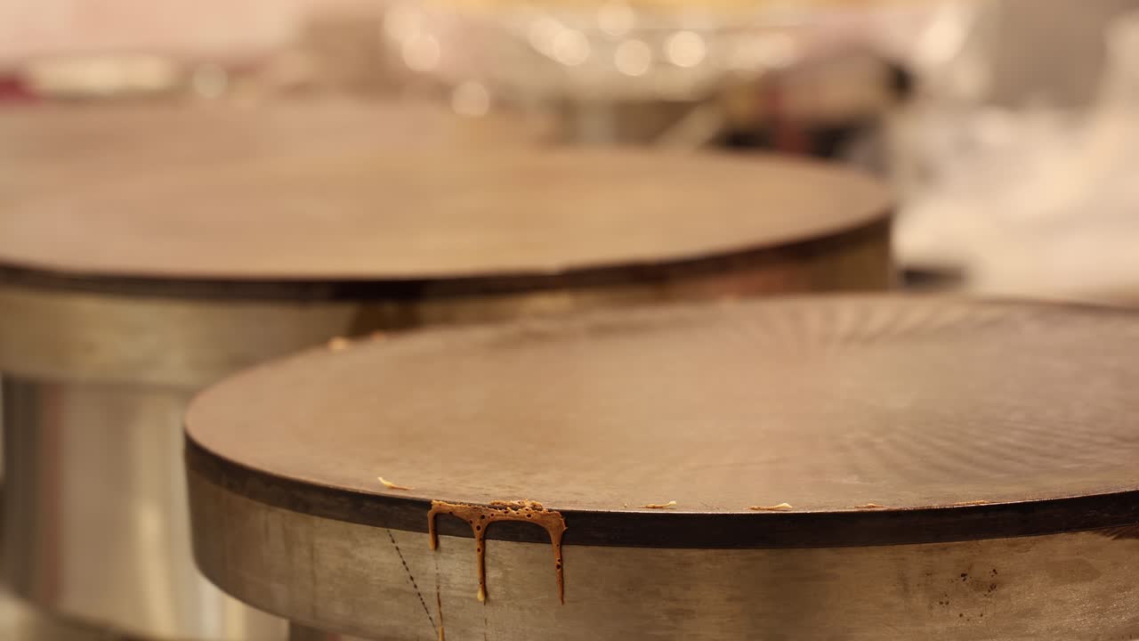 Fresh pancakes made on industrial factory plates, food market