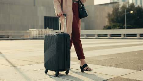 Feet,-woman-and-walking-with-luggage-for-business