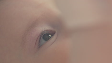 closeup beautiful baby boy eyes, portrait of white caucasian newborn soft light