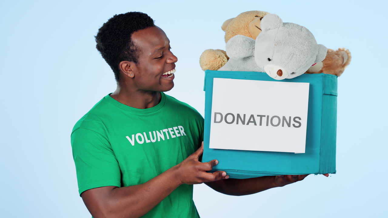 Man, face or donation or box for charity in studio