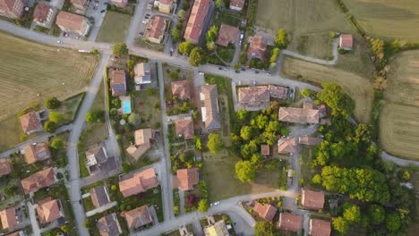 top view of some houses near the countryside during a sunset