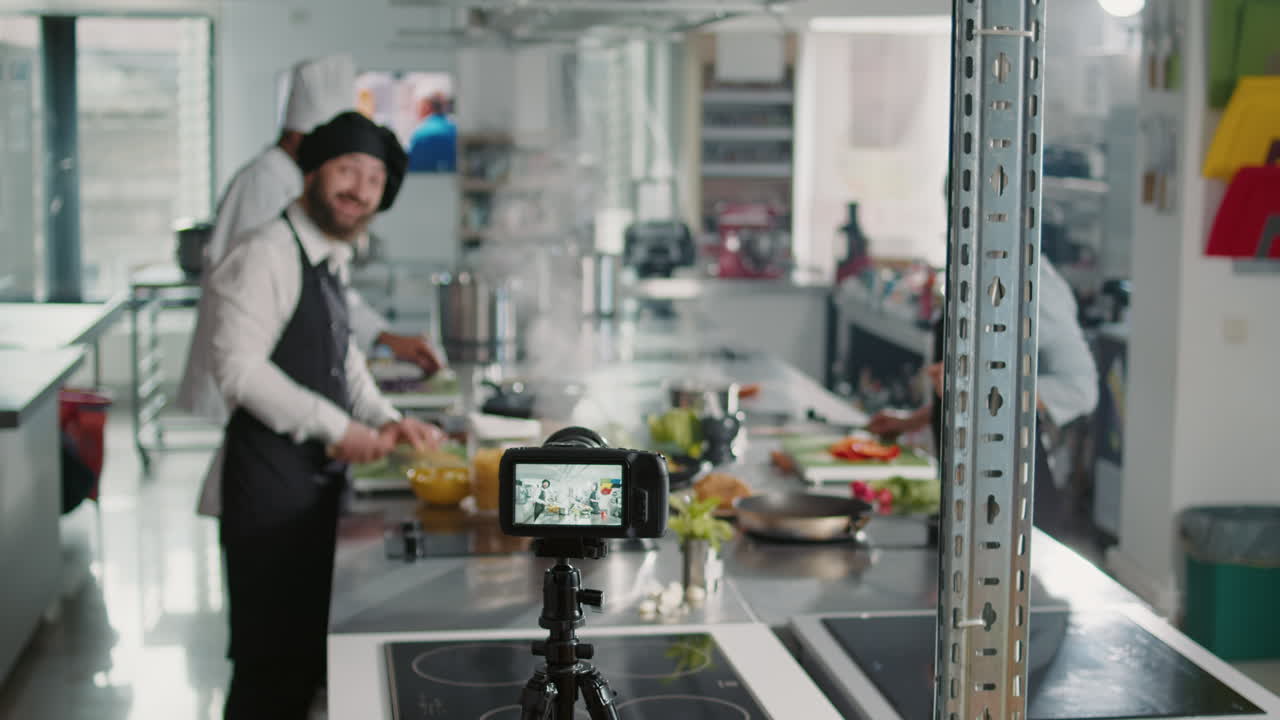 Professional camera recording cooking show content with chefs