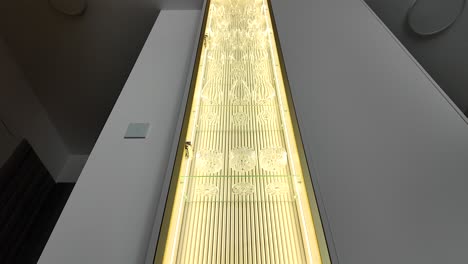 luxurious alcohol cabinet, gold backlit. slow motion video. real estate.