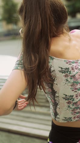 woman walking in city, using smartphone
