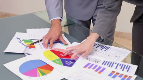 Two-business-people-working-with-charts