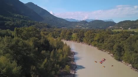 droneshot of several floating boats going upon the river