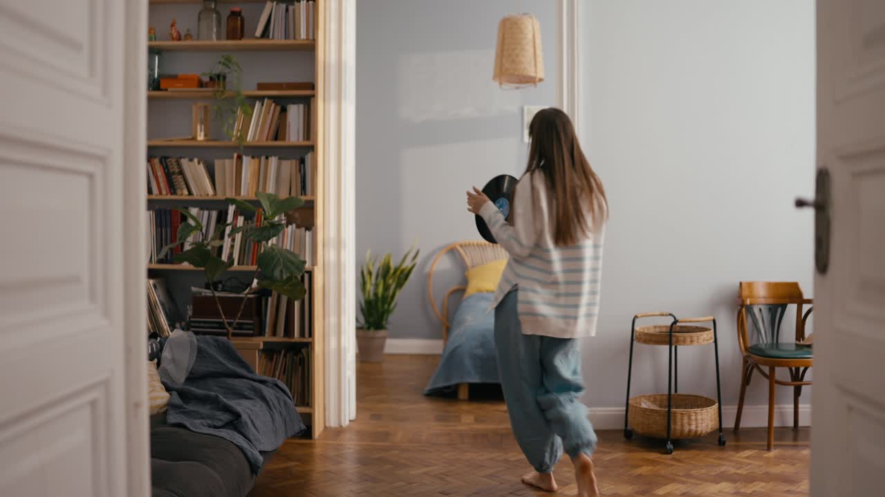 Woman Holding Record in Living Room