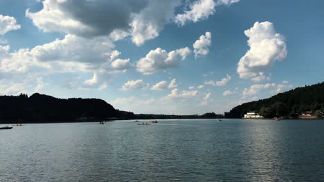 Clip-of-a-tranquil-lake-with-many-tourists-sailing