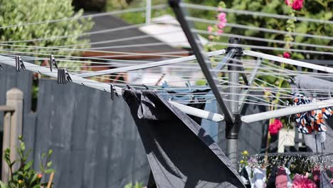 laundry drying on a rotary clothesline outdoors