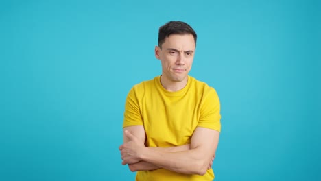 man with various expressions against a blue background