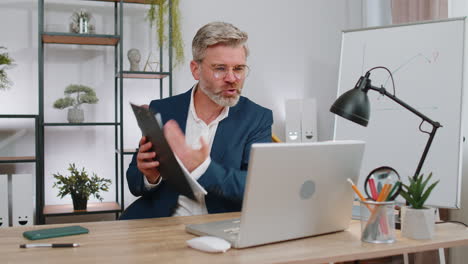 angry businessmanin ceo making laptop call conversation at home office, quarrel conflict negotiation