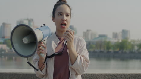 woman giving a speech with a megaphone