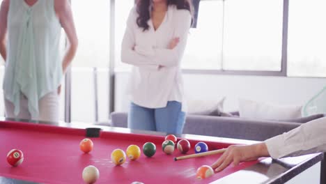 Senior-businessman-playing-billiards-in-modern-office-in-slow-motion