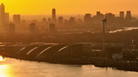 sunset over amsterdam city skyline and harbor
