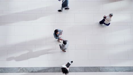 Above,-office-and-business-people-with-a-handshake