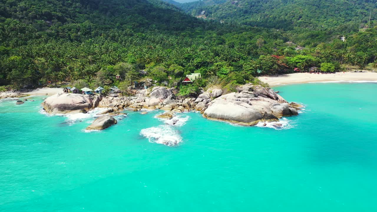 Unspoiled tropical coast with the turquoise seawater, rocks, and jungle. Thailand