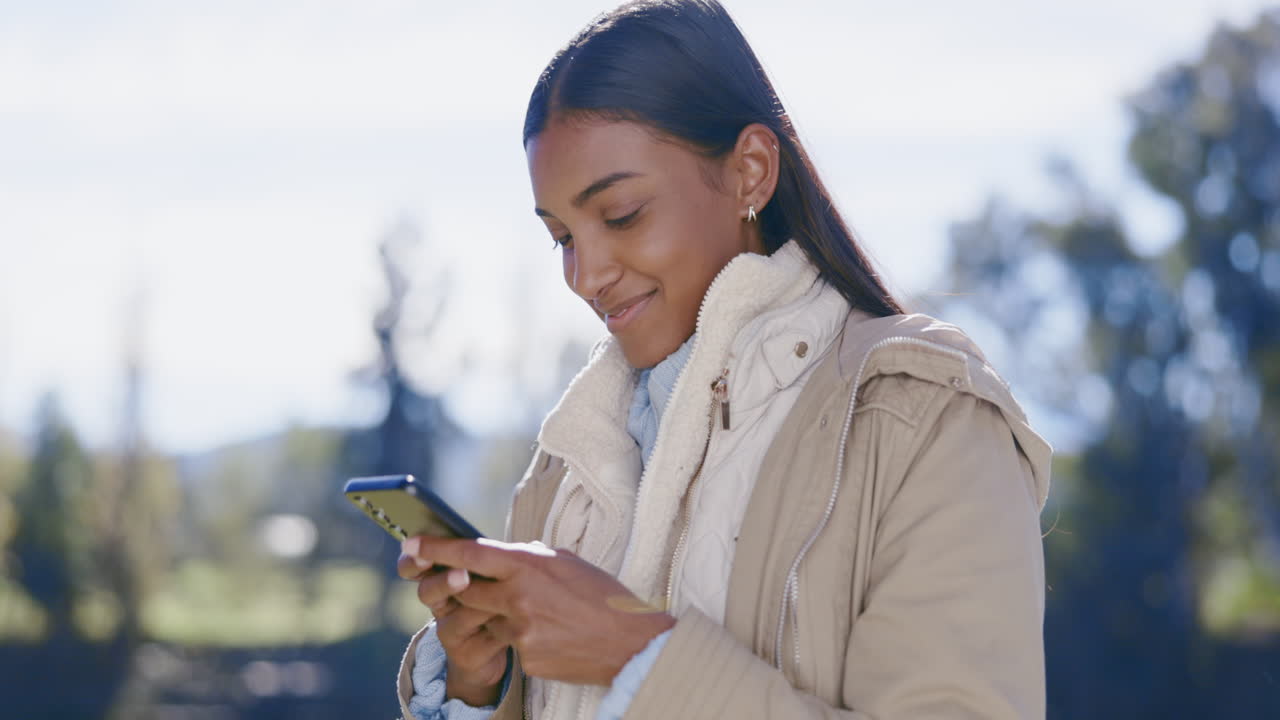 Indian woman, smartphone and chat outdoor