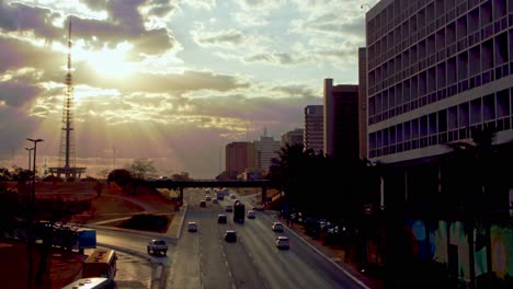 sunbeams shinning through the clouds during the evening highway commute