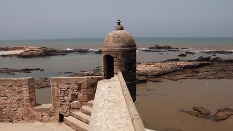 sqala building in essaouira, morocco, is a historic structure with a square shape, thick stone walls, and decorative elements