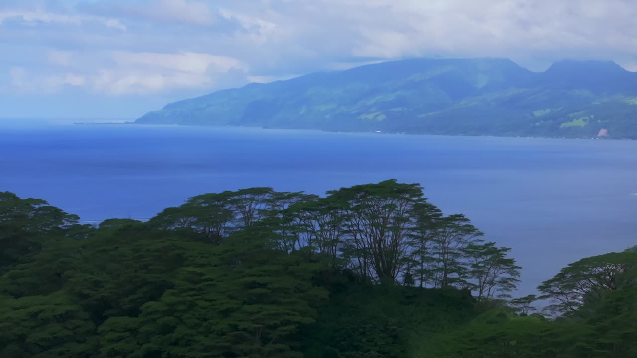 Big Tahiti Island vista point Taiarapu Matiti Taravao village barrier coral reef South Pacific Ocean French Polynesia aerial drone tropical jungle Mont Ronnie Orohena Papeete morning circle right