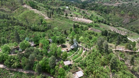 scenic view of bungalows on countryside mountains with rice field terraces in chiang mai province, thailand