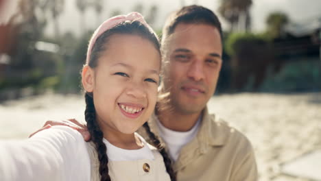 Happy,-child-selfie-and-hug-at-sea-with-dad