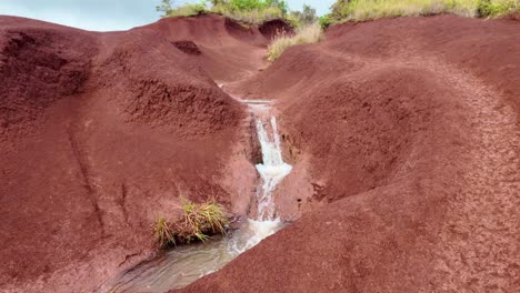 red dirt waterfall in Waimea canyon in kauai, hawaii. The famous Red Dirt Falls, a cascading waterfall of fresh water in Waimea Canyon State Park, located on the island of Kauai, Hawaii