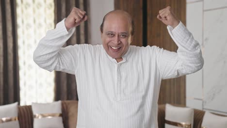 indian old man cheering and celebrating