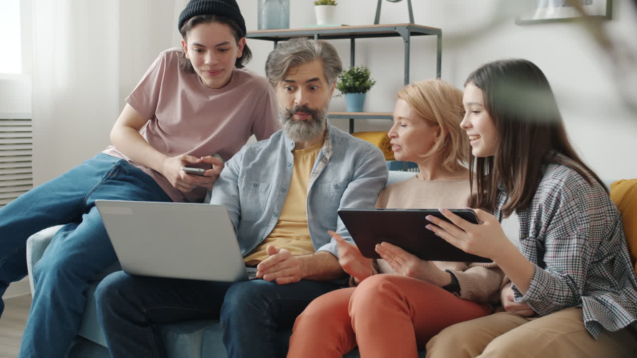 Family using technology together at home