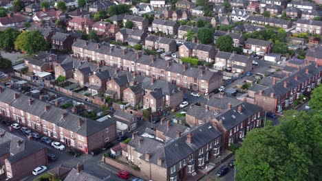 aerial view flying above wealthy cheshire real estate housing property close up zooming out shot