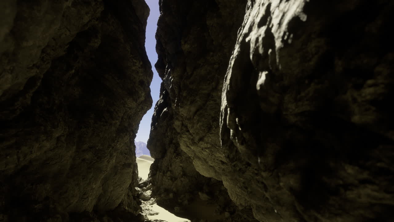 Rocky canyon view with bright sunlight illuminating the sandy path