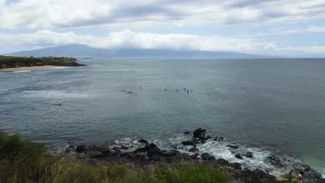 Caution,-Warning-Sign-on-Cliffs-of-Rocky-Maui-Island-Coastline---Aerial